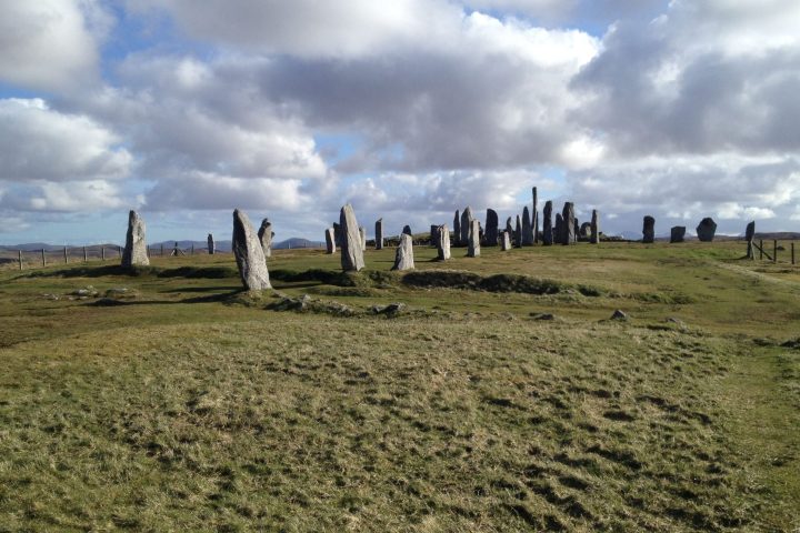 The Callanish standing stones on the Isle of Lewis under a cloudy sky